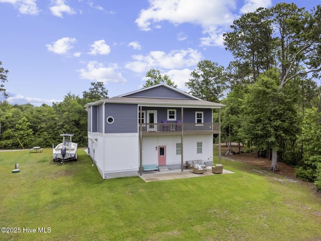 452 Crows Nest Ln, Sneads Ferry, NC 28460 - rear view of house featuring outdoor lounge area, a balcony, a patio, and a yard