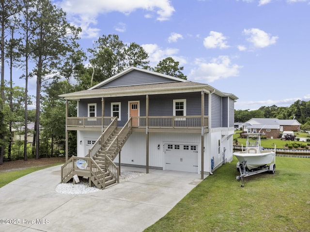452 Crows Nest Ln, Sneads Ferry, NC 28460 - coastal inspired home with an attached garage, a front lawn, concrete driveway, and stairway