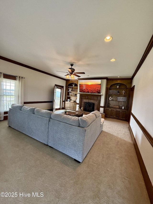 5934 NC-42, Macclesfield, NC 27852 - living room featuring light carpet, crown molding, healthy amount of natural light, a brick fireplace, and ceiling fan