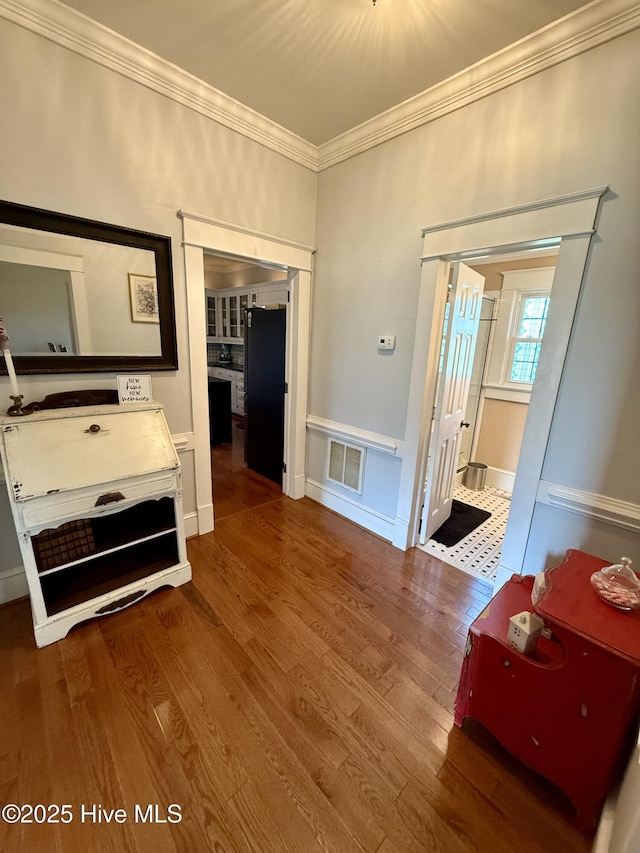 5934 NC-42, Macclesfield, NC 27852 - hall with ornamental molding, wood finished floors, wainscoting, and a decorative wall