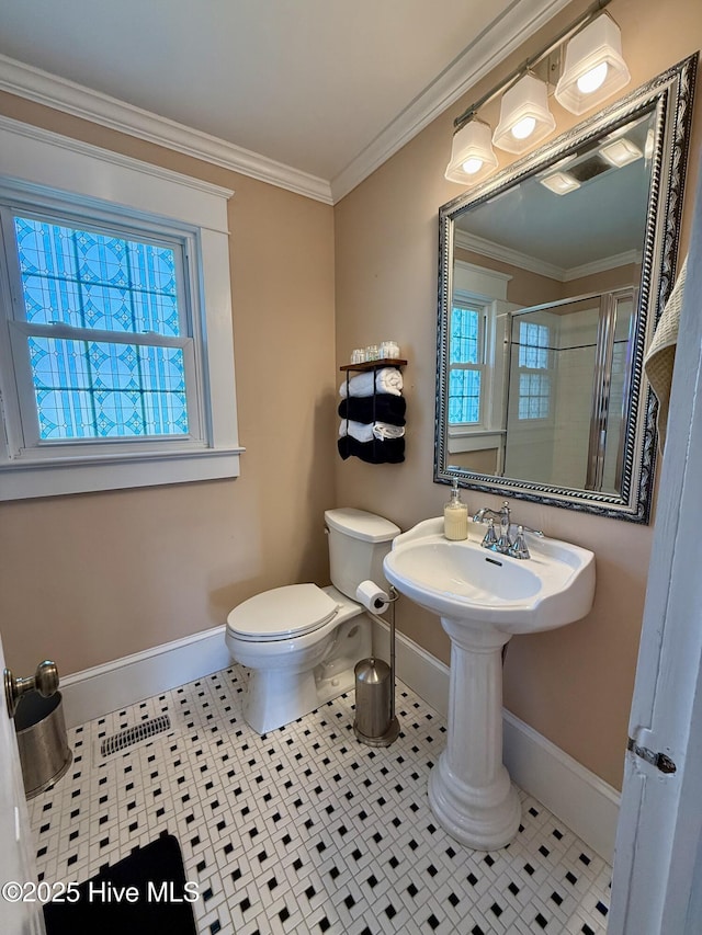5934 NC-42, Macclesfield, NC 27852 - full bath with baseboards, a stall shower, tile patterned flooring, toilet, and crown molding