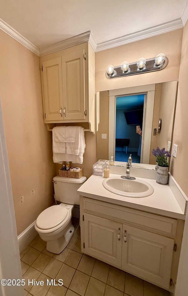 5934 NC-42, Macclesfield, NC 27852 - half bathroom featuring vanity, toilet, tile patterned flooring, ornamental molding, and baseboards
