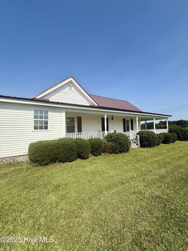 5934 NC-42, Macclesfield, NC 27852 - view of front facade featuring a porch and a front lawn