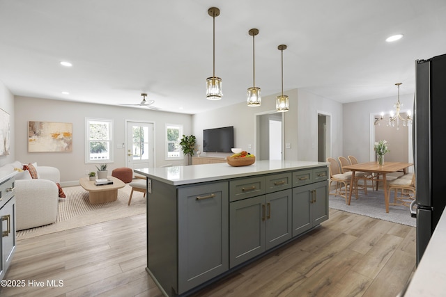 109 Inlet Ct, Hampstead, NC 28443 - kitchen featuring open floor plan, light countertops, freestanding refrigerator, light wood-style floors, and recessed lighting