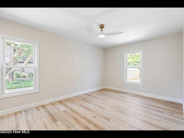 109 Inlet Ct, Hampstead, NC 28443 - empty room featuring healthy amount of natural light, light wood-style floors, ceiling fan, and baseboards