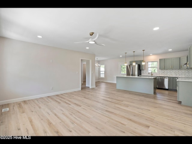 109 Inlet Ct, Hampstead, NC 28443 - kitchen with stainless steel appliances, a chandelier, light countertops, a kitchen island, and open floor plan