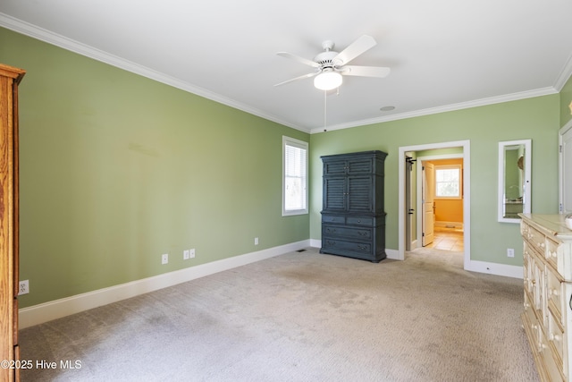 209 Georgia Ave, Carolina Beach, NC 28428 - unfurnished bedroom featuring ornamental molding, light carpet, multiple windows, baseboards, and a ceiling fan
