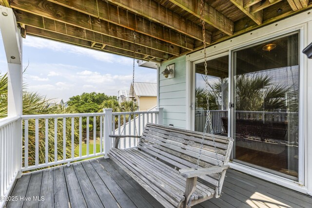 209 Georgia Ave, Carolina Beach, NC 28428 - bedroom with vaulted ceiling, light colored carpet, and a ceiling fan