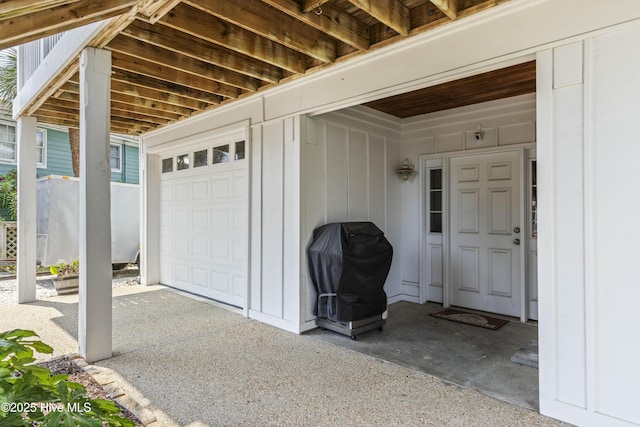 209 Georgia Ave, Carolina Beach, NC 28428 - entrance to property with a garage and board and batten siding