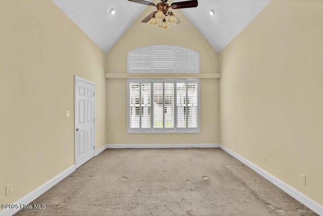 205 S Grist Mill Rd, Hampstead, NC 28443 - spare room with carpet, a ceiling fan, high vaulted ceiling, and baseboards