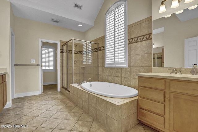 205 S Grist Mill Rd, Hampstead, NC 28443 - bathroom featuring vanity, a shower stall, a garden tub, tile patterned floors, and lofted ceiling
