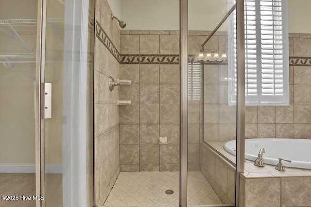 205 S Grist Mill Rd, Hampstead, NC 28443 - bathroom featuring a shower stall and a garden tub