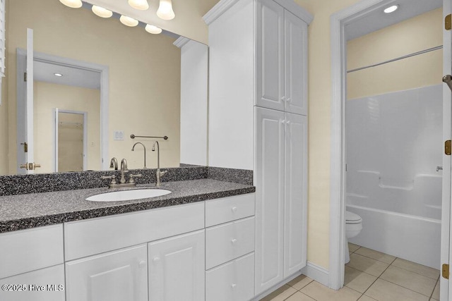 205 S Grist Mill Rd, Hampstead, NC 28443 - full bath featuring vanity, tile patterned flooring, toilet, a closet, and  shower combination