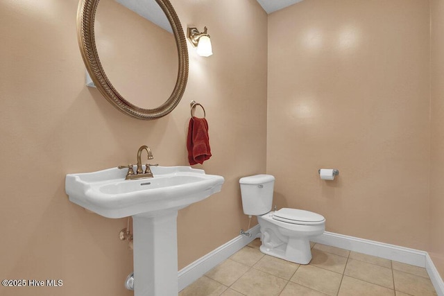 205 S Grist Mill Rd, Hampstead, NC 28443 - half bath with baseboards, toilet, and tile patterned floors