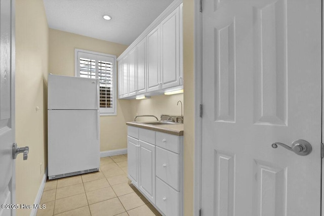 205 S Grist Mill Rd, Hampstead, NC 28443 - washroom featuring baseboards, light tile patterned floors, a sink, and recessed lighting