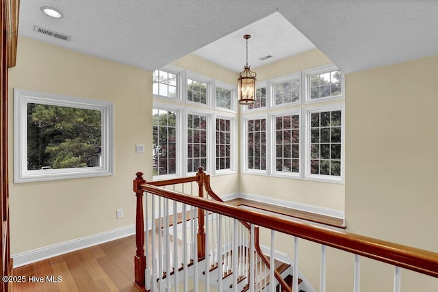 205 S Grist Mill Rd, Hampstead, NC 28443 - hall featuring baseboards, wood finished floors, an upstairs landing, and recessed lighting