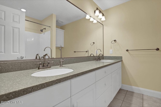 205 S Grist Mill Rd, Hampstead, NC 28443 - bathroom with tile patterned flooring, double vanity, and baseboards