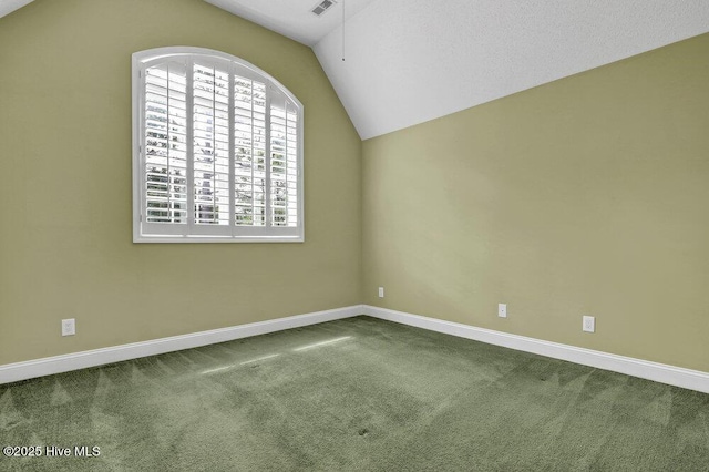 205 S Grist Mill Rd, Hampstead, NC 28443 - spare room with vaulted ceiling, carpet, and baseboards