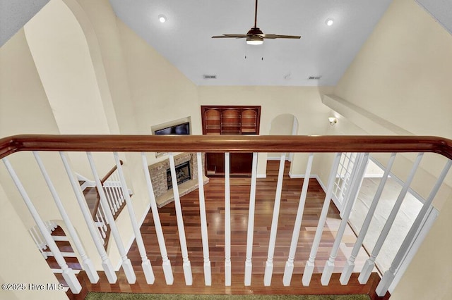 205 S Grist Mill Rd, Hampstead, NC 28443 - staircase with wood finished floors, ceiling fan, recessed lighting, and a fireplace with raised hearth