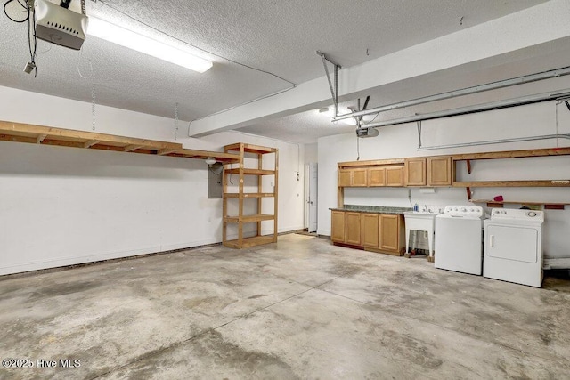 205 S Grist Mill Rd, Hampstead, NC 28443 - garage with washer and dryer, a garage door opener, and electric panel