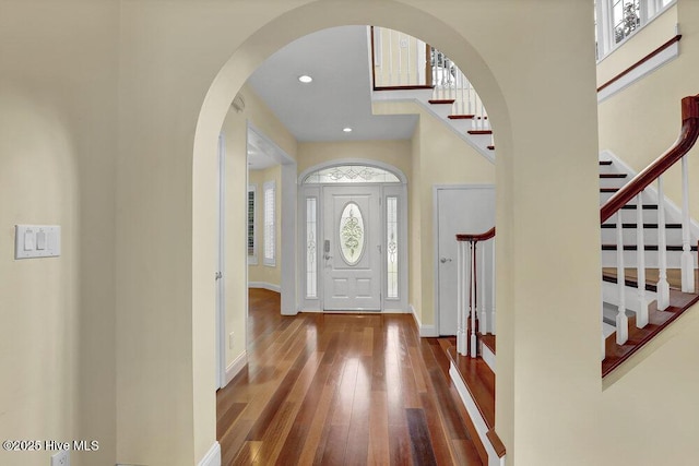 205 S Grist Mill Rd, Hampstead, NC 28443 - foyer featuring stairs, hardwood / wood-style flooring, baseboards, arched walkways, and recessed lighting