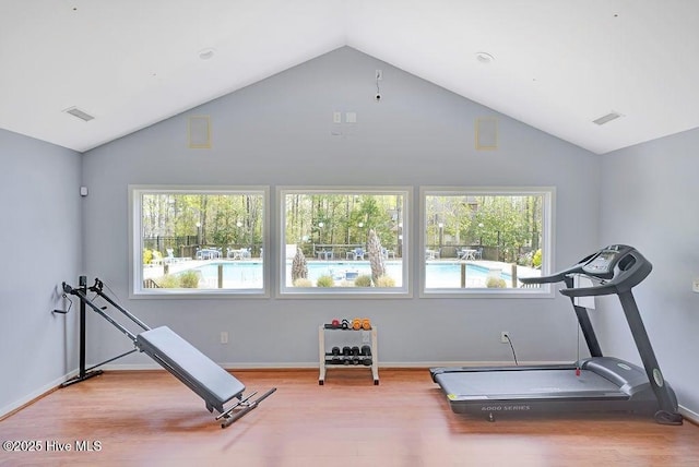205 S Grist Mill Rd, Hampstead, NC 28443 - workout room with lofted ceiling, wood finished floors, and baseboards