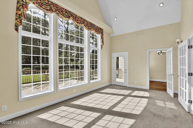 205 S Grist Mill Rd, Hampstead, NC 28443 - unfurnished sunroom with french doors, vaulted ceiling, and a chandelier