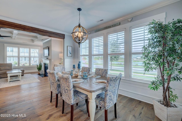 232 Trawlers Way, Wilmington, NC 28412 - dining room with a chandelier, crown molding, wood finished floors, beamed ceiling, and coffered ceiling
