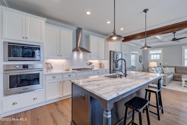 232 Trawlers Way, Wilmington, NC 28412 - kitchen featuring appliances with stainless steel finishes, wall chimney exhaust hood, open floor plan, light wood-type flooring, and recessed lighting