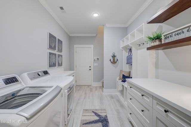 232 Trawlers Way, Wilmington, NC 28412 - laundry room featuring independent washer and dryer, cabinet space, ornamental molding, baseboards, and light wood-style flooring