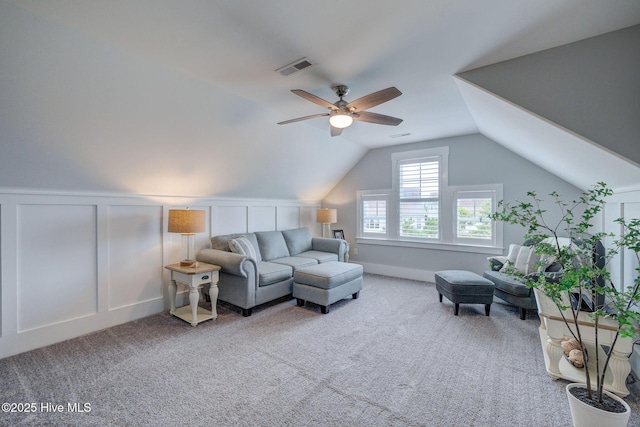 232 Trawlers Way, Wilmington, NC 28412 - living room featuring a ceiling fan, a decorative wall, carpet, and vaulted ceiling
