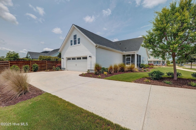 232 Trawlers Way, Wilmington, NC 28412 - view of front of home featuring driveway, an attached garage, and roof with shingles