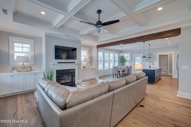 232 Trawlers Way, Wilmington, NC 28412 - living area featuring ornamental molding, light wood finished floors, ceiling fan, beam ceiling, and recessed lighting