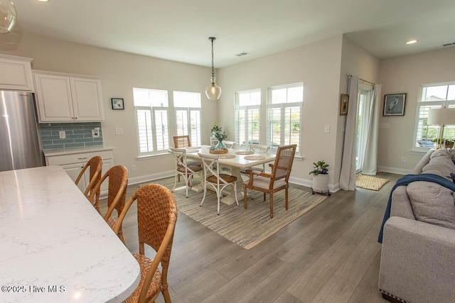 873 Bourne Dr SW, Ocean Isle Beach, NC 28469 - dining area featuring baseboards, dark wood finished floors, and recessed lighting