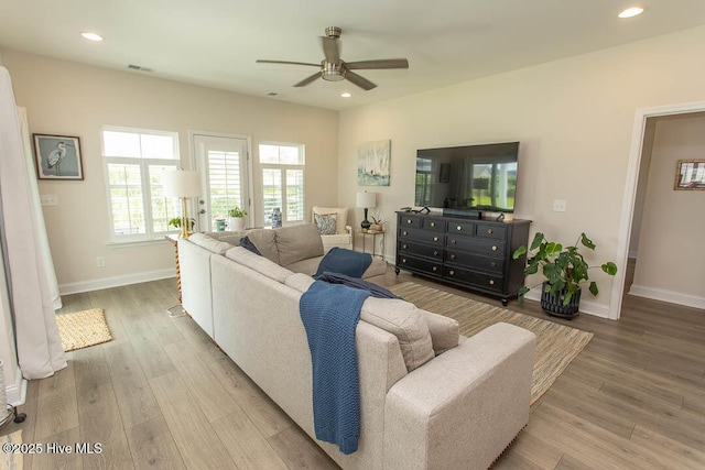 873 Bourne Dr SW, Ocean Isle Beach, NC 28469 - living room featuring a ceiling fan, baseboards, light wood-type flooring, and recessed lighting
