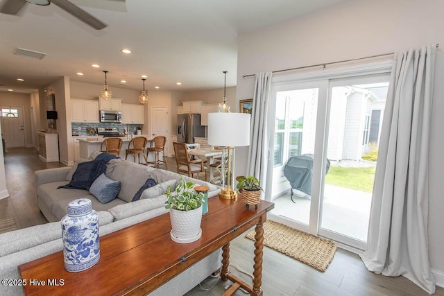 873 Bourne Dr SW, Ocean Isle Beach, NC 28469 - living room with wood finished floors, ceiling fan, recessed lighting, and baseboards