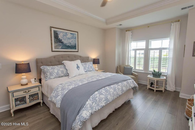 873 Bourne Dr SW, Ocean Isle Beach, NC 28469 - bedroom with a tray ceiling, crown molding, wood finished floors, and baseboards