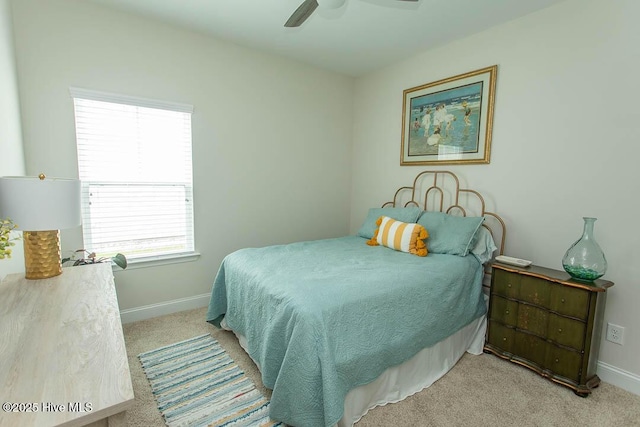 873 Bourne Dr SW, Ocean Isle Beach, NC 28469 - bedroom featuring light carpet, multiple windows, baseboards, and a ceiling fan