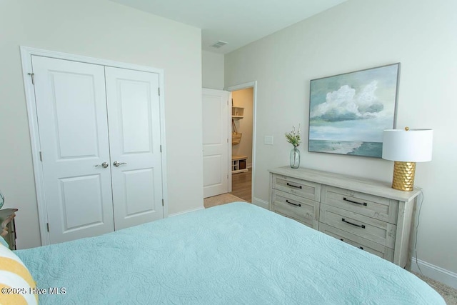 873 Bourne Dr SW, Ocean Isle Beach, NC 28469 - carpeted bedroom featuring a closet and baseboards