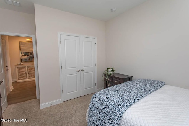 873 Bourne Dr SW, Ocean Isle Beach, NC 28469 - carpeted bedroom with a closet and baseboards
