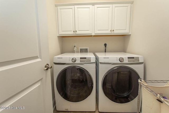 873 Bourne Dr SW, Ocean Isle Beach, NC 28469 - laundry area featuring washer and dryer and cabinet space