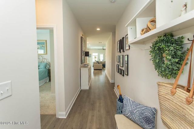 873 Bourne Dr SW, Ocean Isle Beach, NC 28469 - hallway with dark wood finished floors, baseboards, and recessed lighting