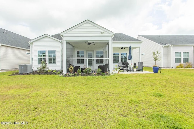 873 Bourne Dr SW, Ocean Isle Beach, NC 28469 - back of house featuring a ceiling fan, a patio area, a yard, and cooling unit