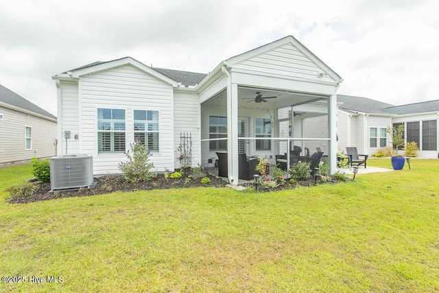 873 Bourne Dr SW, Ocean Isle Beach, NC 28469 - rear view of property with ceiling fan, a lawn, a sunroom, cooling unit, and a patio