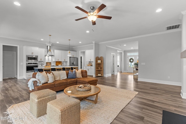 386 Yucca Ln, Wilmington, NC 28412 - living room featuring a ceiling fan, recessed lighting, baseboards, dark wood-style flooring, and ornamental molding
