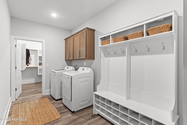 386 Yucca Ln, Wilmington, NC 28412 - laundry area featuring washing machine and dryer, dark wood finished floors, baseboards, cabinet space, and recessed lighting