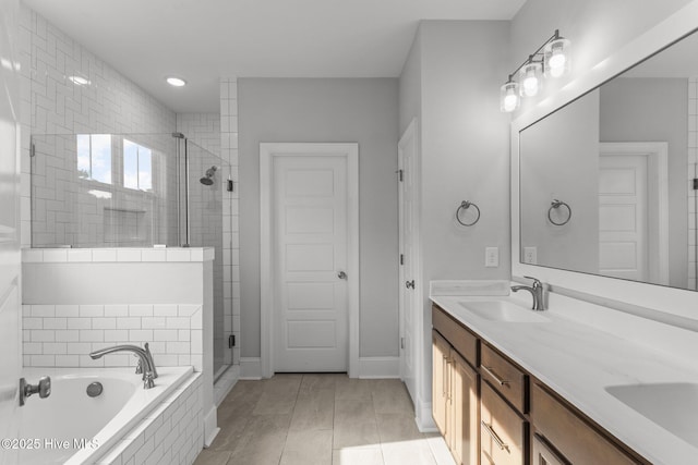 386 Yucca Ln, Wilmington, NC 28412 - full bath featuring a stall shower, a garden tub, double vanity, baseboards, and recessed lighting