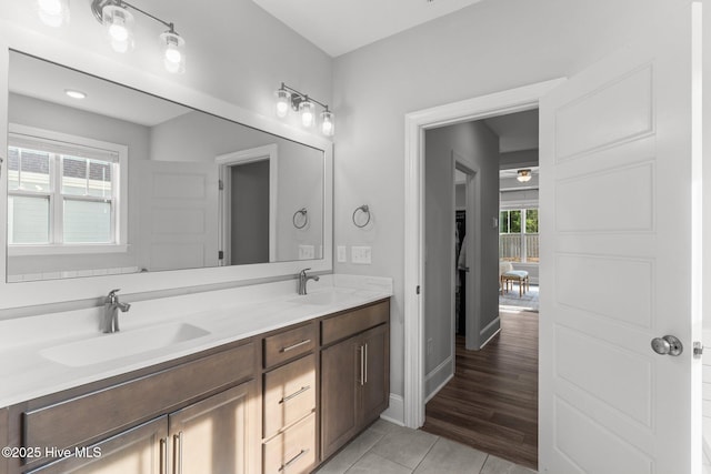 386 Yucca Ln, Wilmington, NC 28412 - bathroom featuring double vanity, tile patterned flooring, baseboards, and a ceiling fan