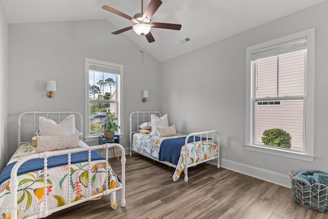 386 Yucca Ln, Wilmington, NC 28412 - bedroom featuring wood finished floors, baseboards, ceiling fan, and high vaulted ceiling