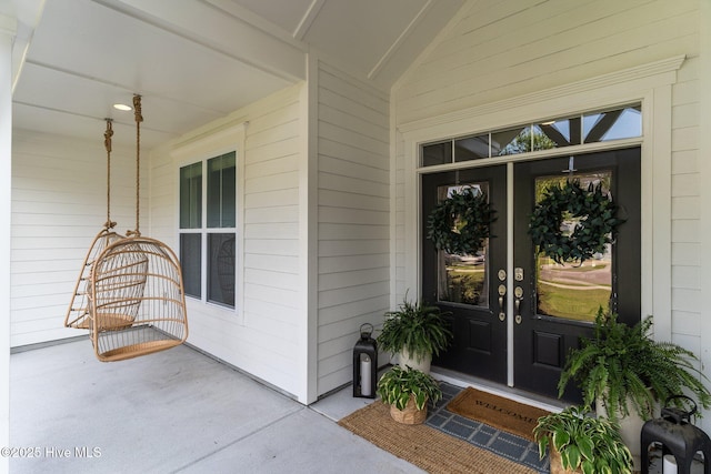 386 Yucca Ln, Wilmington, NC 28412 - doorway to property featuring covered porch and french doors